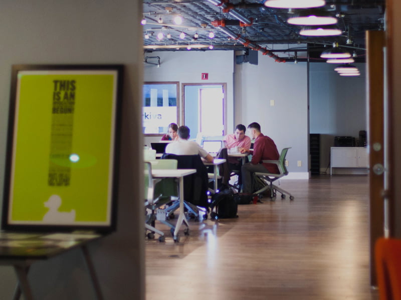 People at desk discussing brand strategy