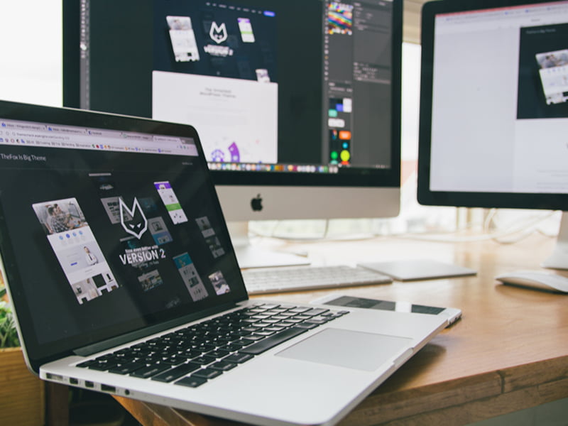Website Design shown on Laptop and Desktop