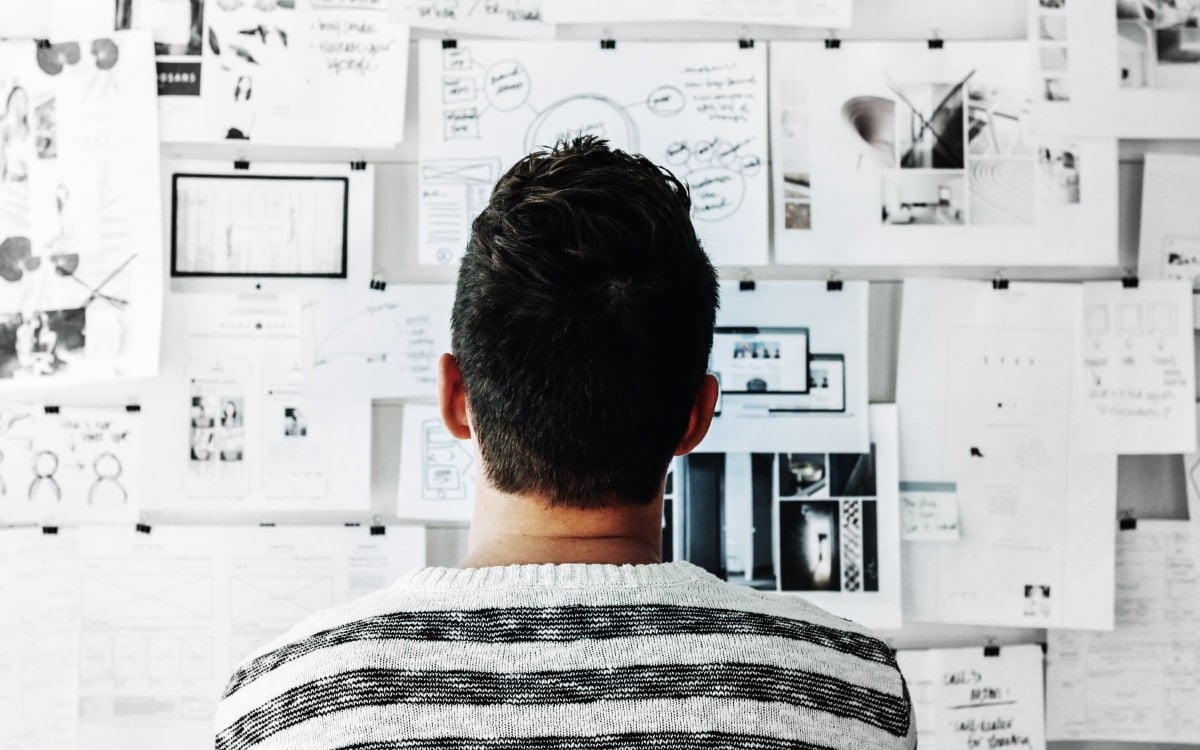What is Branding - man looking at notes on wall